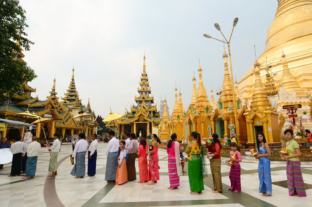 People praying at Shwedagon Pagoda in Yangon, Myanmar