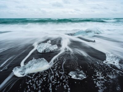Icy beach in Iceland, Europe. Ice on the black volcanic sand on