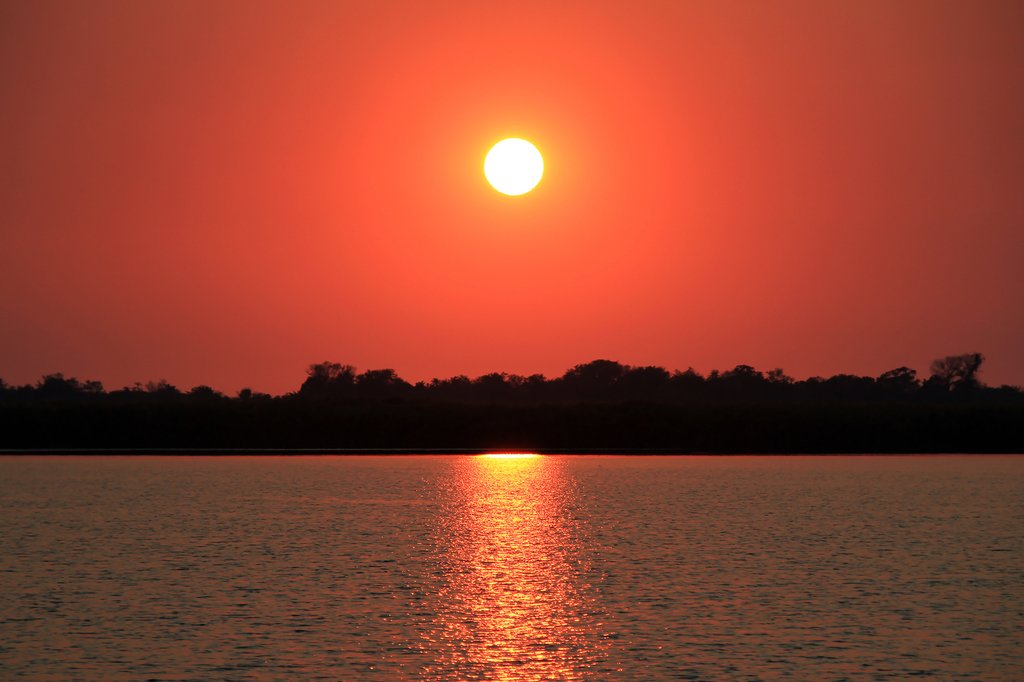 Sunrise over Guma Lagoon in Okavango Delta