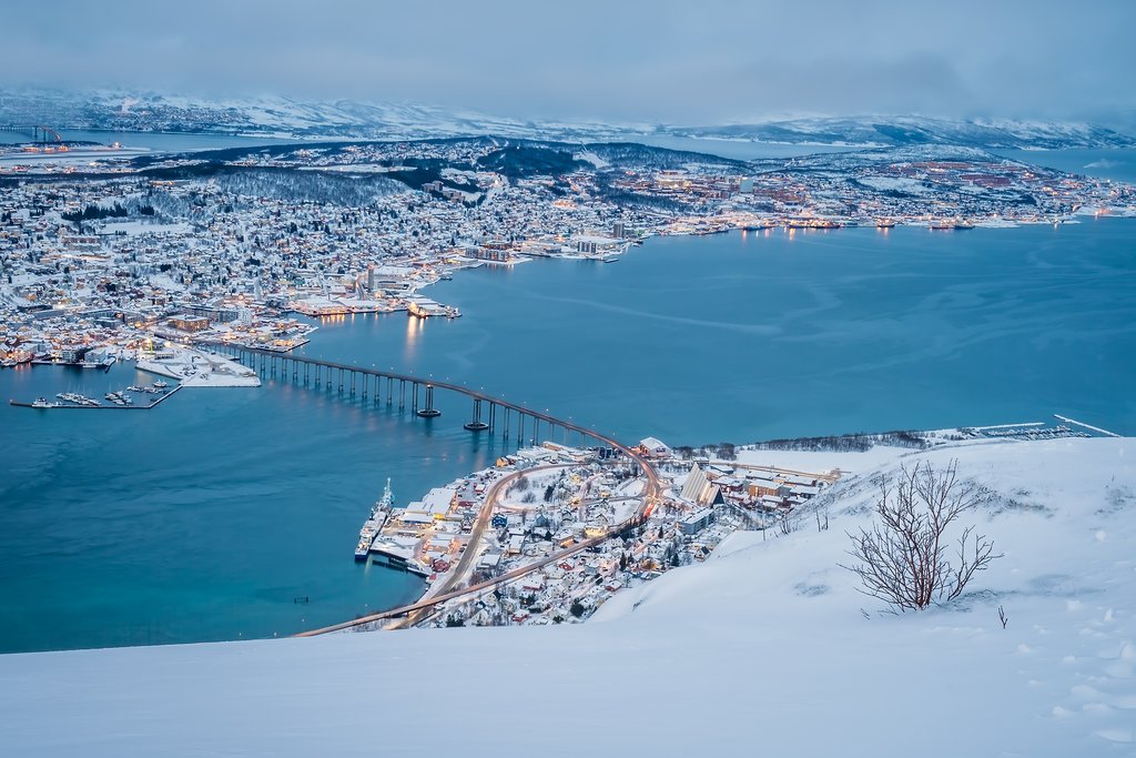 An aerial view of Tromsø from the mountain ledge