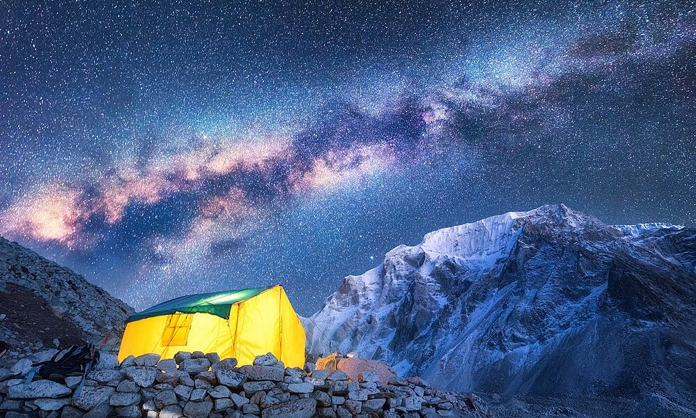 Milky Way, Yellow Glowing Tent And Mountains. Space
