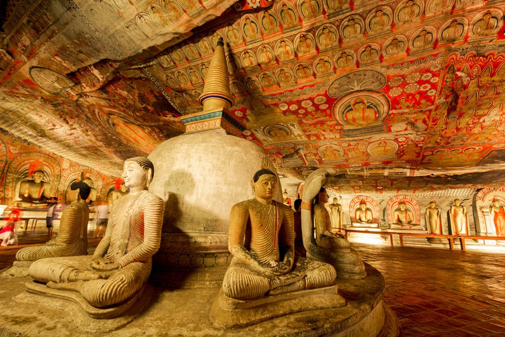 Intricate ancient art fills the caves of Dambulla