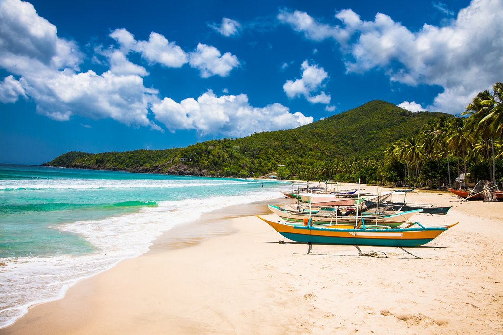 Traditional long boats in Sabang, the Philippines