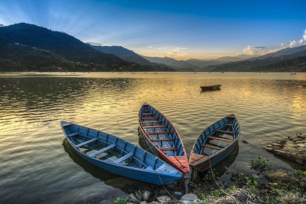 Boats along the shore of Phewa Lake