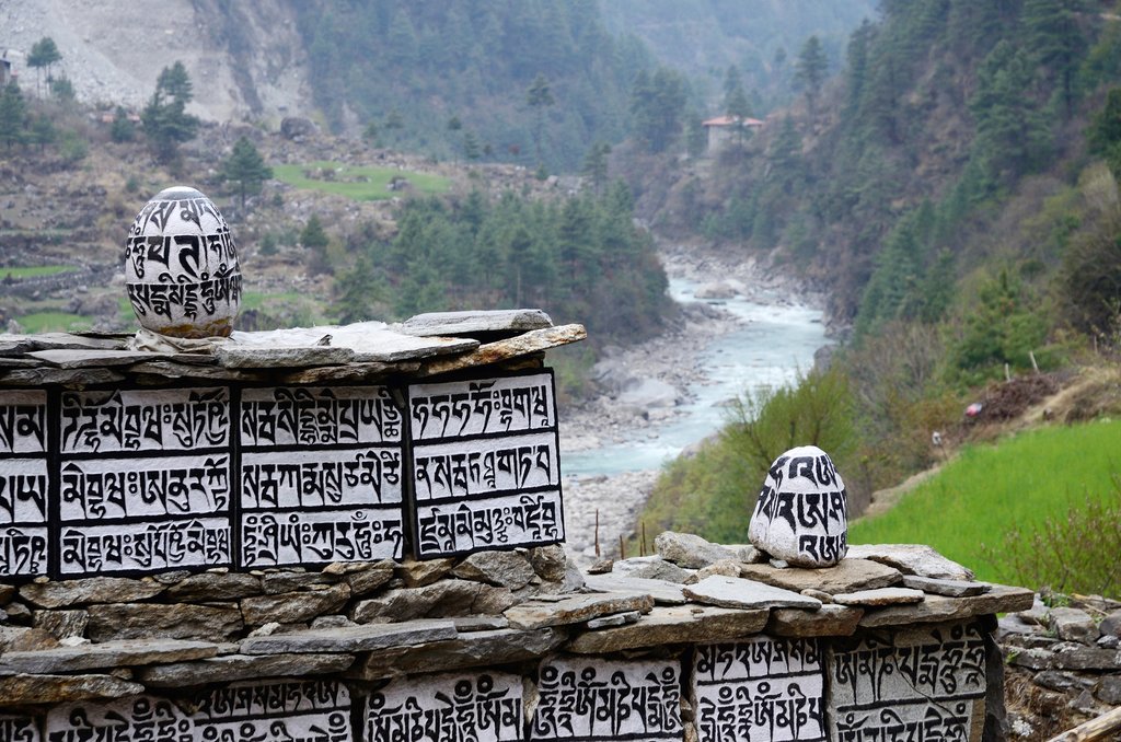 Buddhist mani stones with sacred mantras near Dudh Kosi river,Eastern Nepal, Everest region