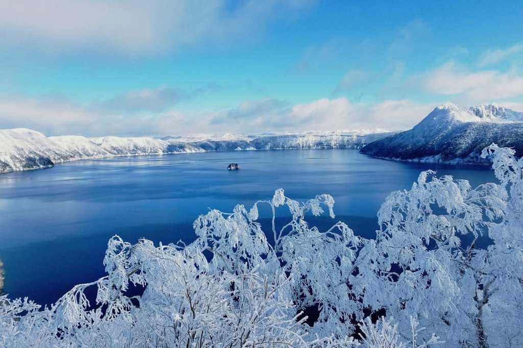Hokkaido's crystal-clear Lake Mashu, a crater lake formed from an ancient volcano.