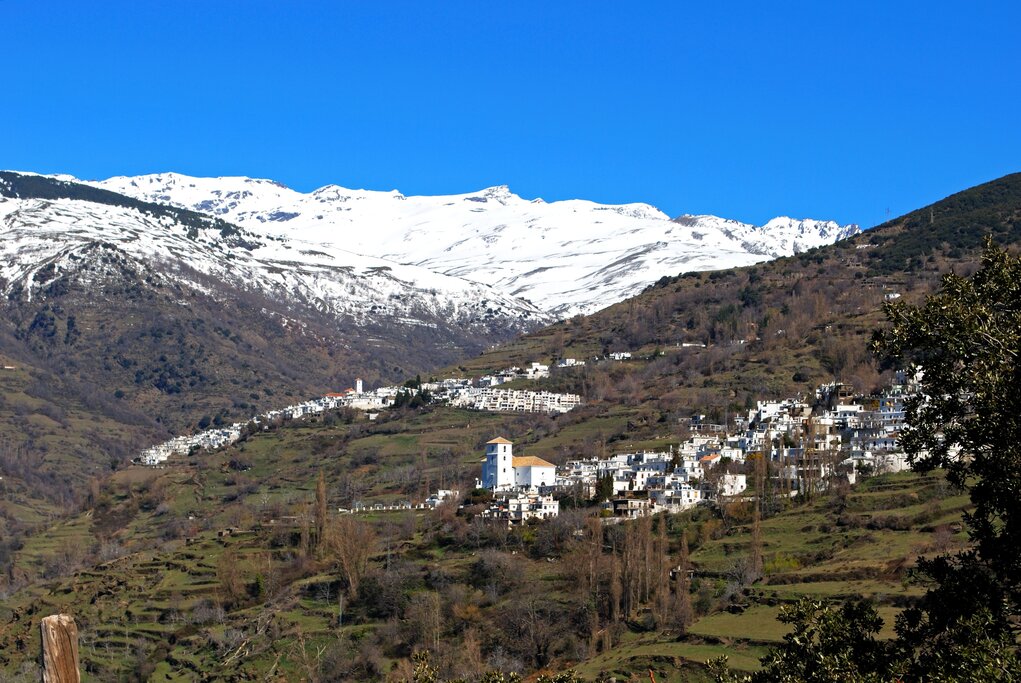 The towns of Bubion and, in the background, Capileira, two of the prettiest of the mountain settlements in the Las Alpujarras - image by ArenaPhotoUK