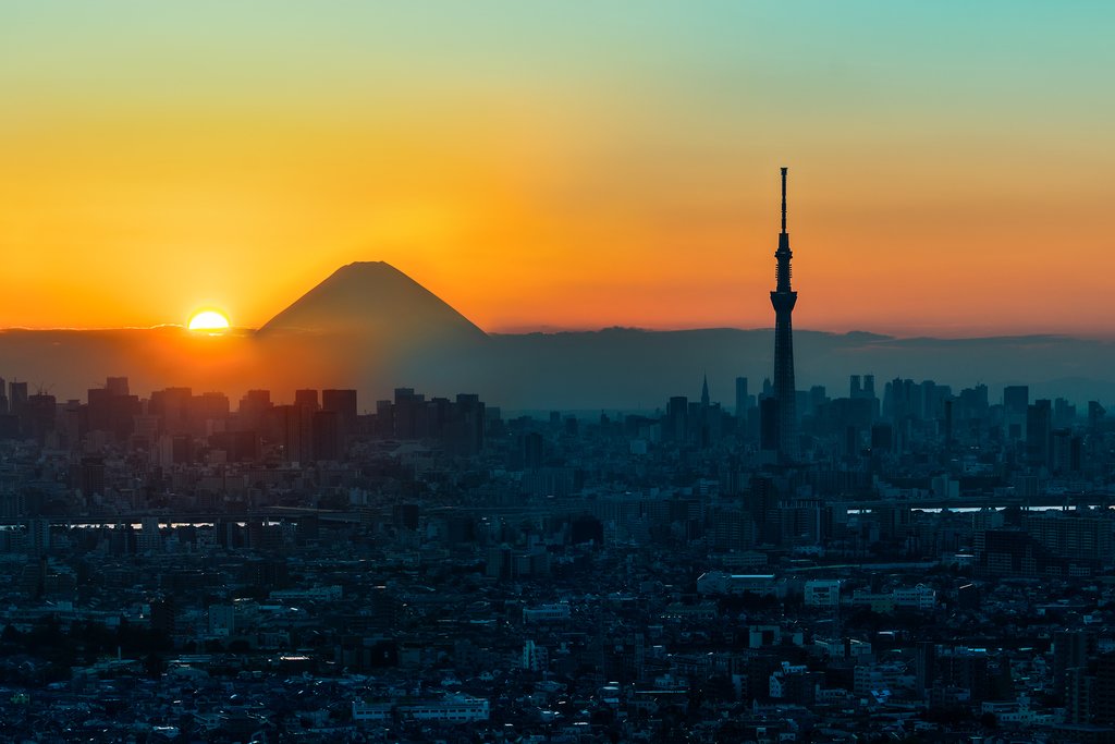 Sunset over Tokyo and Mount Fuji in the distance.