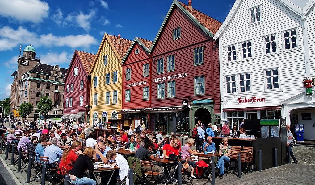 People Sit In Street Cafe In Bergen, Norway