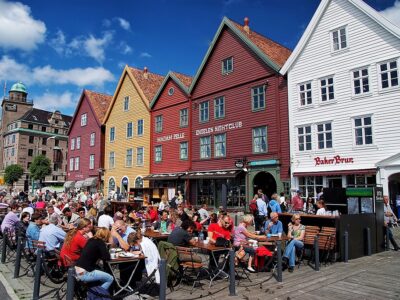 People Sit In Street Cafe In Bergen, Norway
