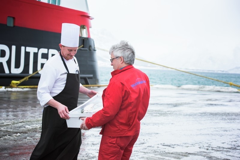Loading the day's catch on board.