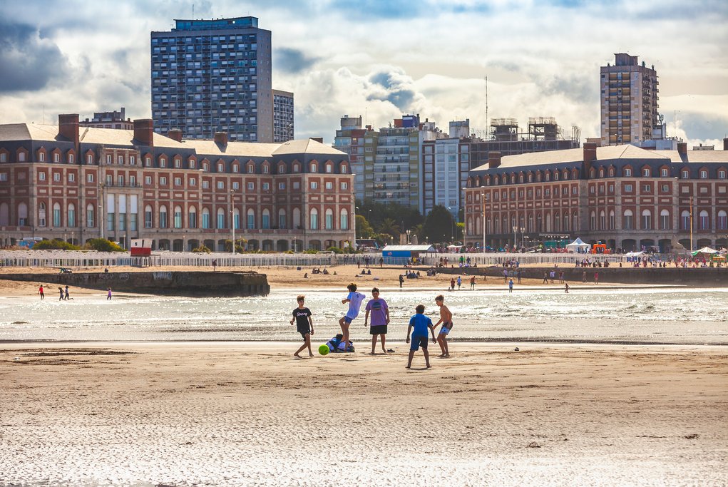 Kids playing soccer on the beach in Mar del Plata, Argentina
