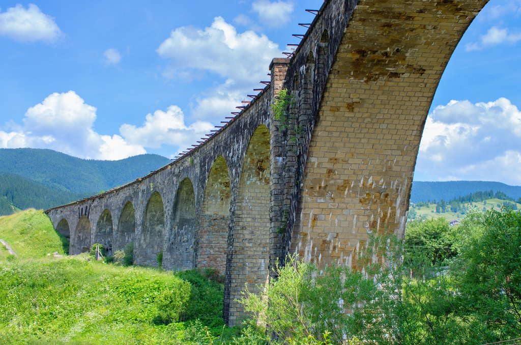 Railway viaduct old bridge on a background of mountains