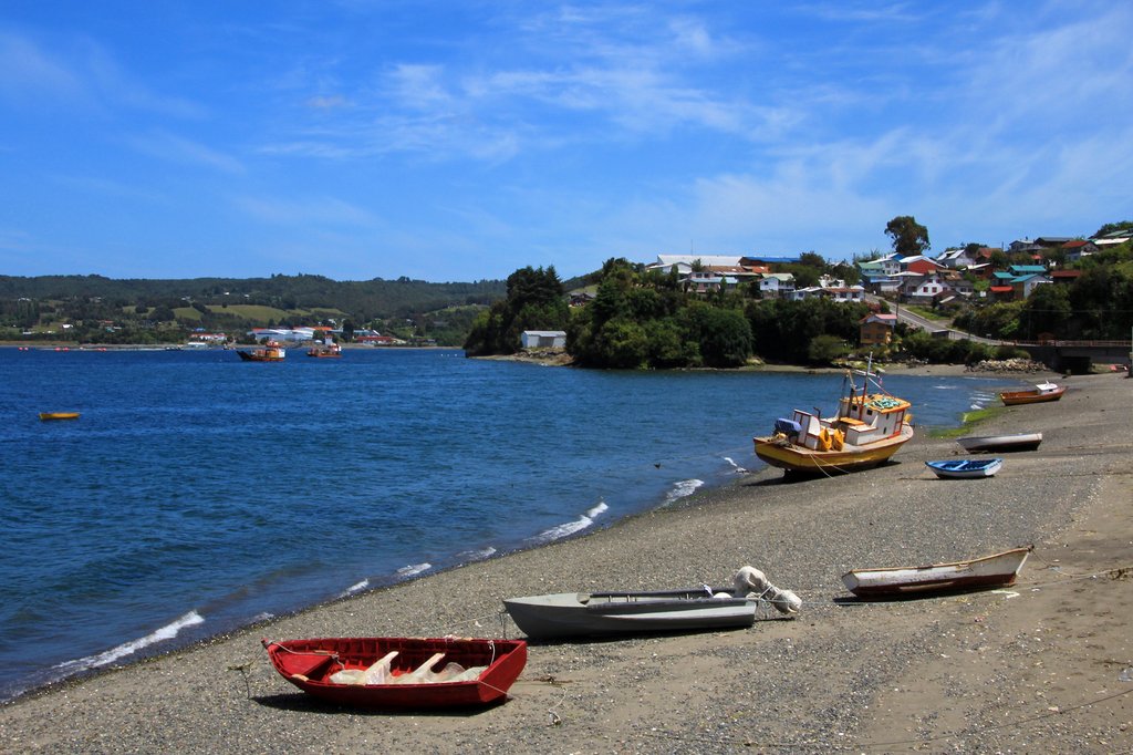 Fishing boats dot the seashore on Chiloé Island