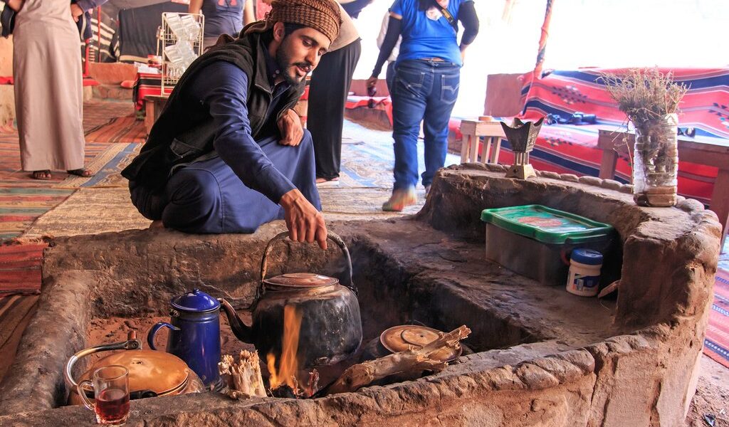 Wadi Rum, Jordan - March 24,2015: Bedouin Serving Tea To The Tou