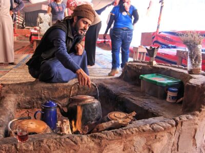 Wadi Rum, Jordan - March 24,2015: Bedouin Serving Tea To The Tou