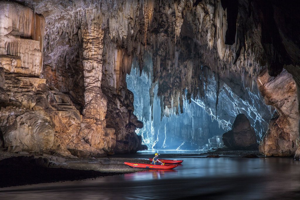 Explore Tam Lod cave system by boat or bamboo raft