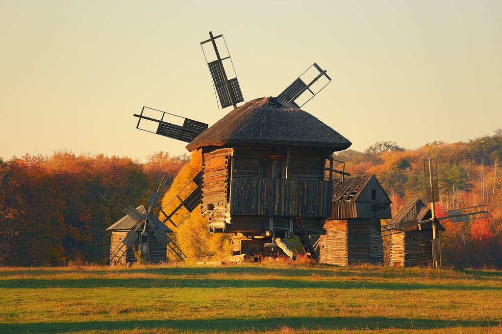 Ukraine - Traditional ukrainian windmill in the museum of national architecture in Pirohiv in a beautiful autumn day before sunset