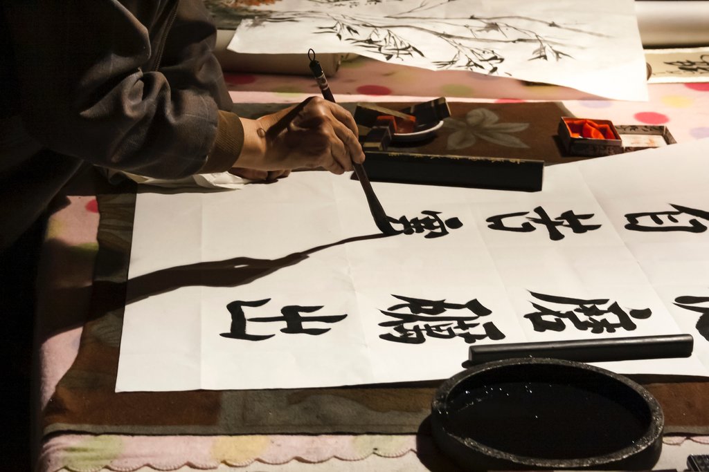 Practicing Shodo calligraphy in Kyoto.