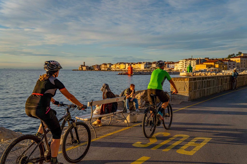 Cycling at sunset along the Adriatic Coast.