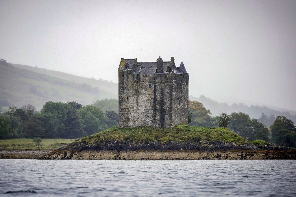 Castle Stalker guarding its own private island.