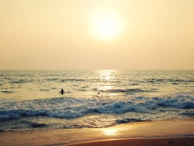 A Few Tourists On The Tropical Ocean Beach - Retro Effect. Sunse
