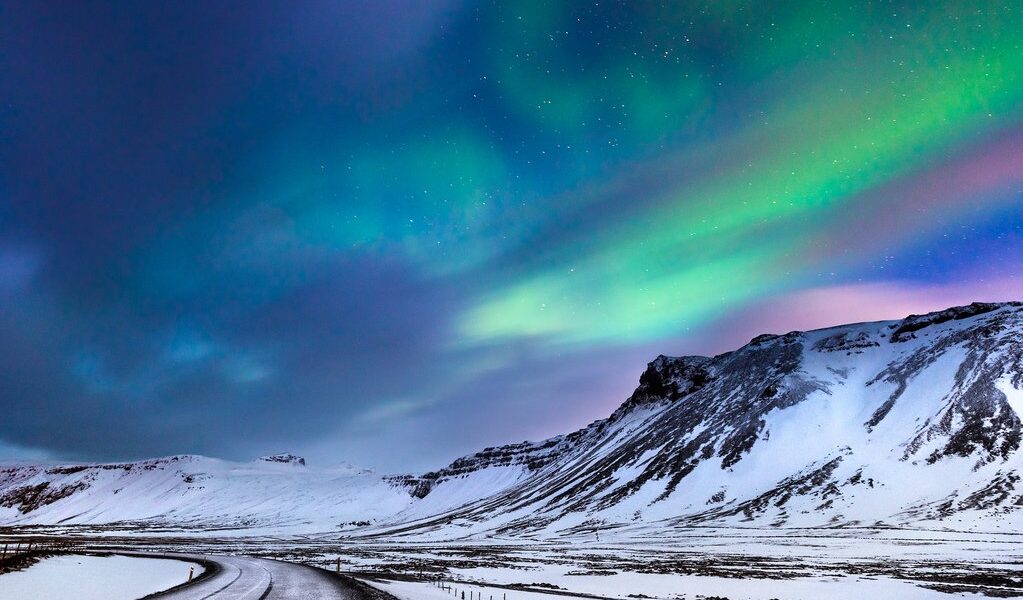 Beautiful landscape of the northern lights over hight mountains