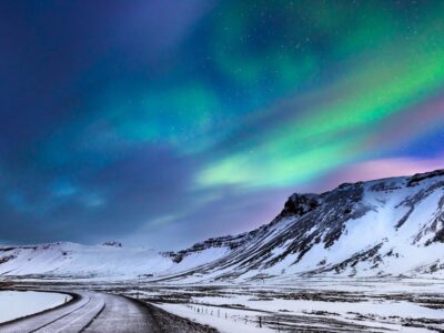 Beautiful landscape of the northern lights over hight mountains