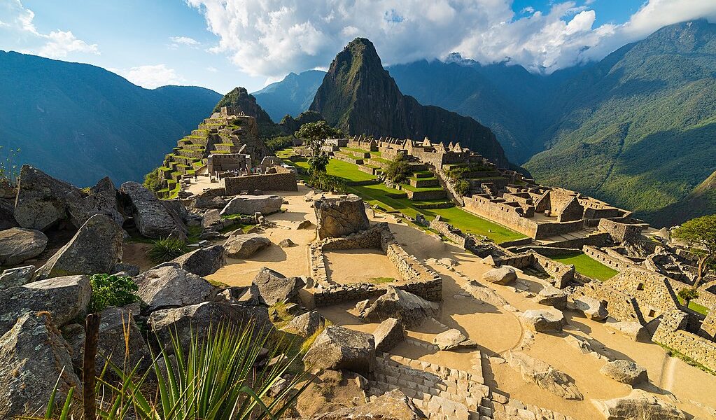 Machu Picchu Illuminated By The Warm Sunset Light. Wide Angle Vi