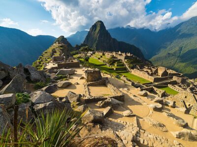 Machu Picchu Illuminated By The Warm Sunset Light. Wide Angle Vi