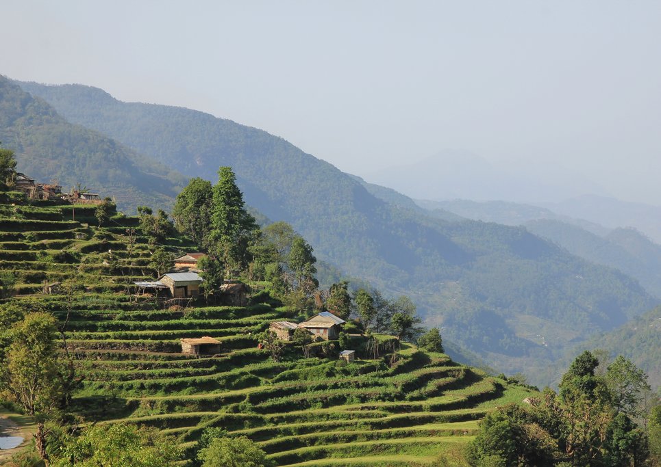 Tiered hillside and traditional structures on the way to Landruk