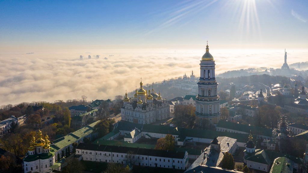 Aerial view of the Monument Motherland, shrouded in thick fog at dawn, Kiev, Ukraine