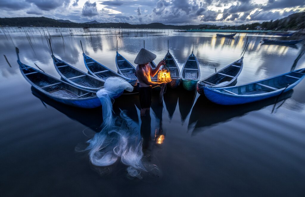 Fishermen on the water in Vietnam
