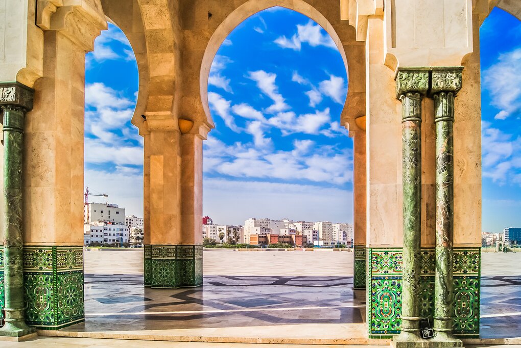 Details of the Hassan II Mosque up close with Casablanca in the distance
