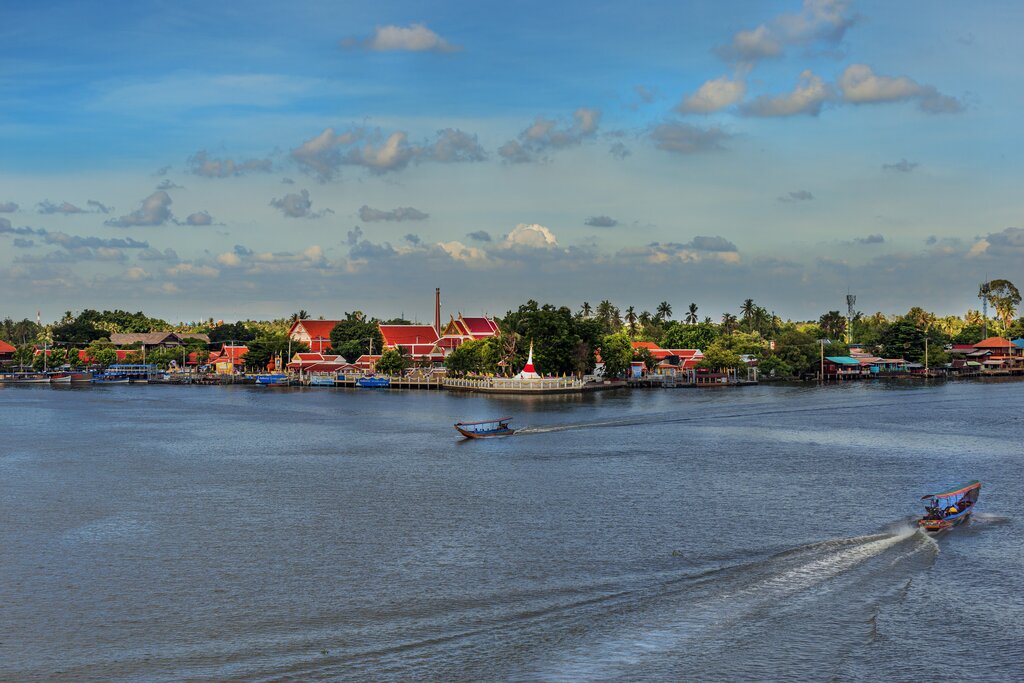 A view from the water of the tilted pagoda on Ko Kret 