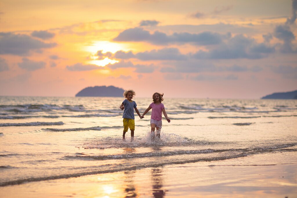 Spain - Family - Let the children play in the surf of one of Costa Brava's many beaches