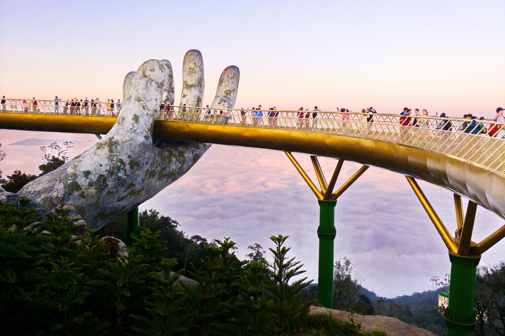 Stroll through the crowds on the Golden Bridge in Da Nang