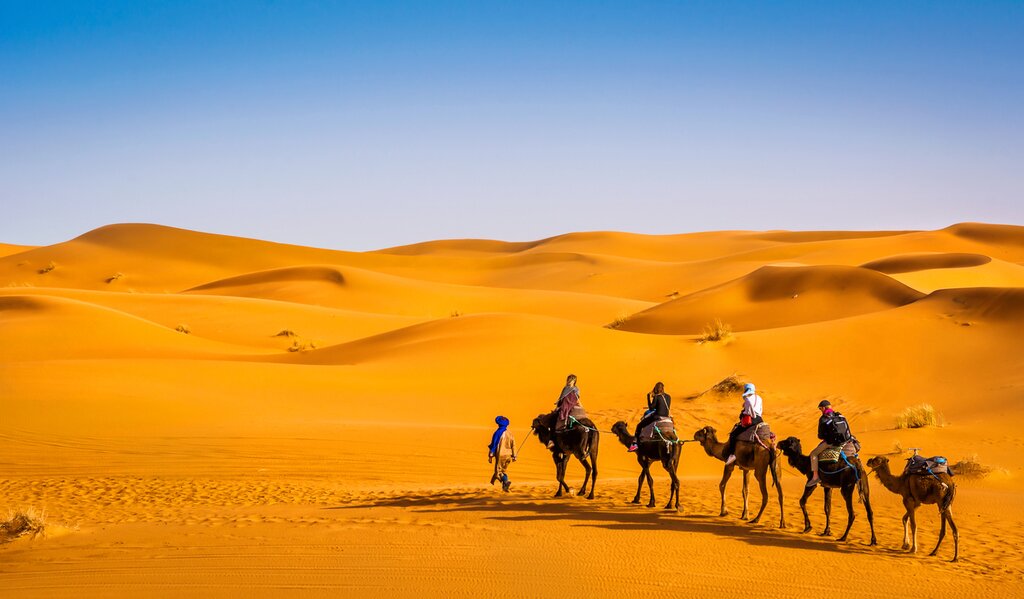 Take a memorable sunset camel ride in the sand dunes of Merzouga