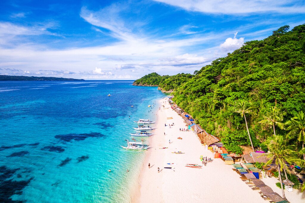 Relax on the white sand of Puka Beach in Boracay