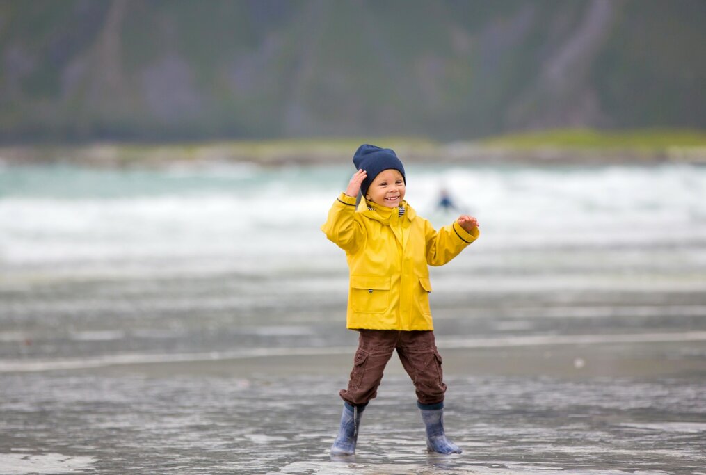 Boy on beach in Lofoten islands