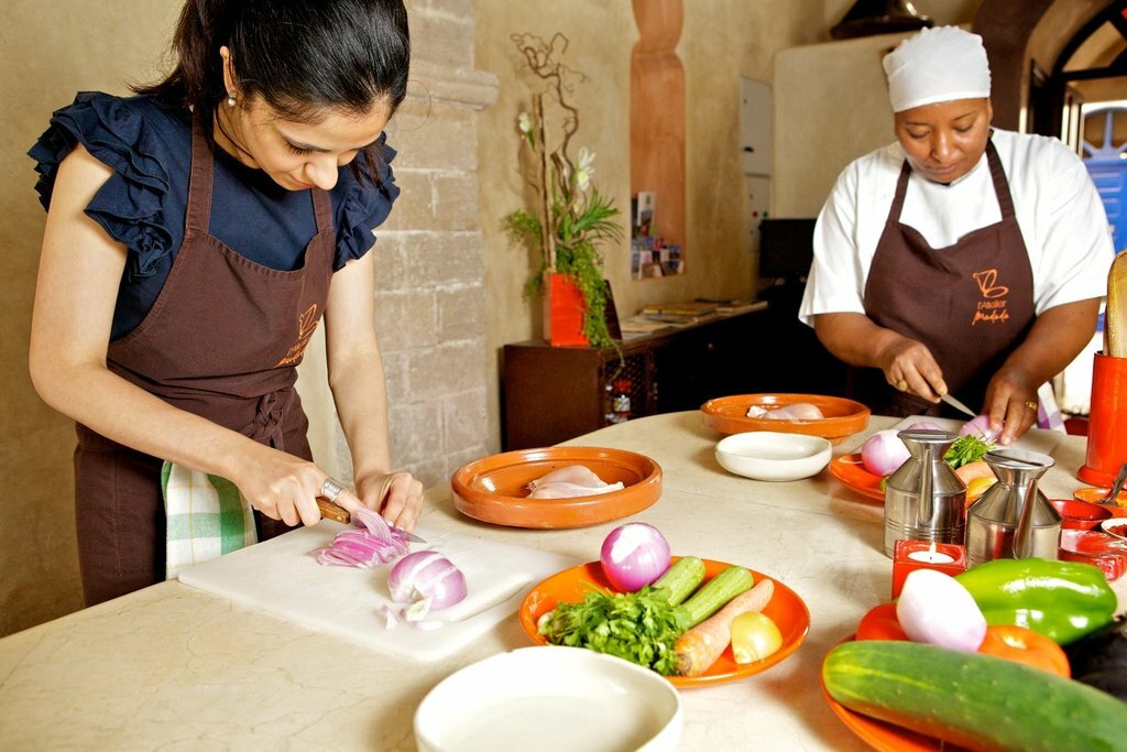Cooking class, woman making tajine (or tagine)