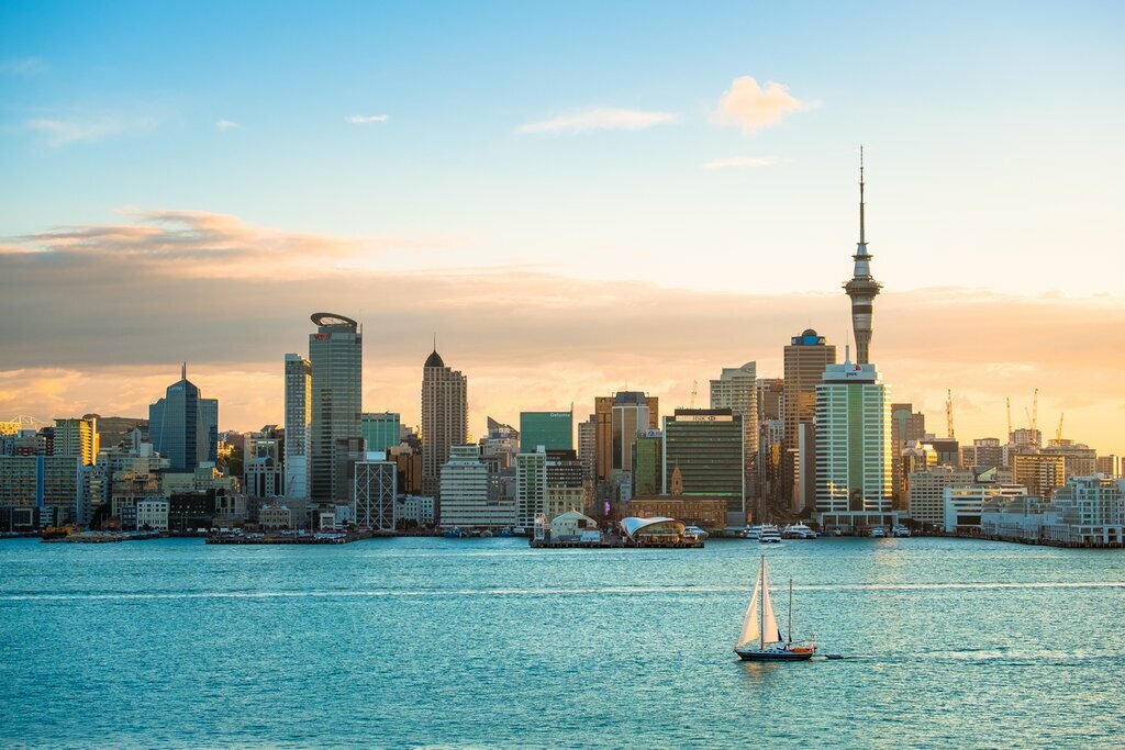 view of Auckland across the harbor with a sailboat in the foreground