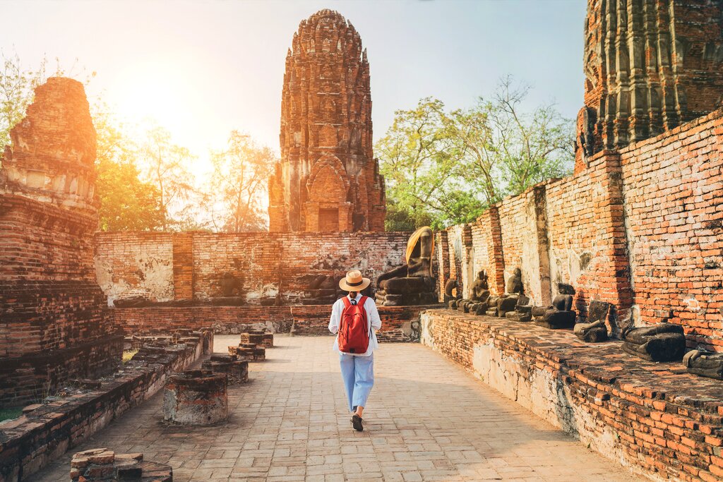 A female tourist exploring temple ruins in Ayutthaya