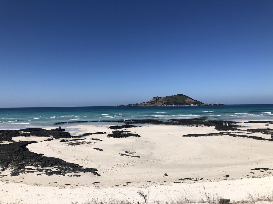 white sands of South Korean beach on Jeju Island