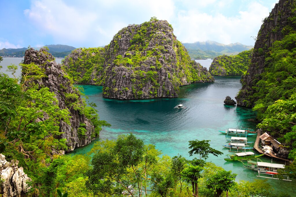 Explore the turquoise waters around Coron