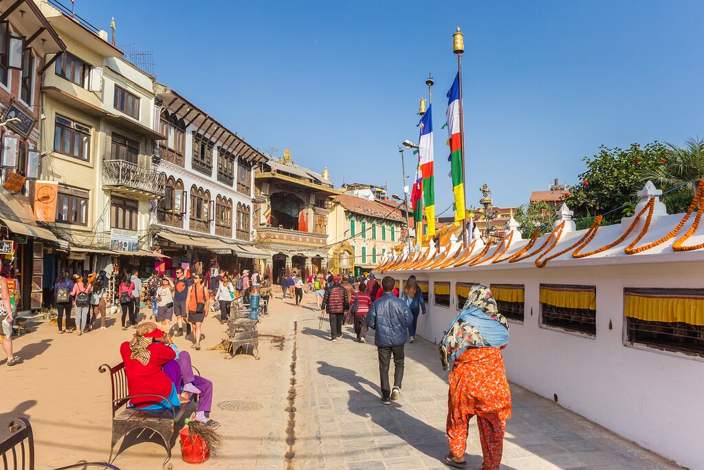 KATHMANDU, NEPAL - NOVEMBER 14, 2019: People walking round the Boudhanath stupa in Kathmandu, Nepal