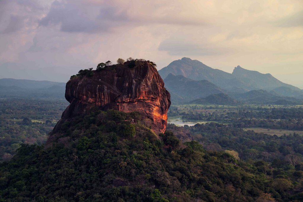 The iconic rock fortress of Sigirya rises 1,124 feet (349 m) out of the jungle 