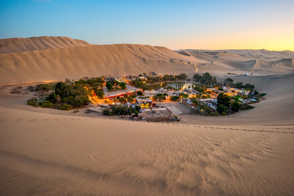 The village of Huacachina in the Ica Desert at sunset