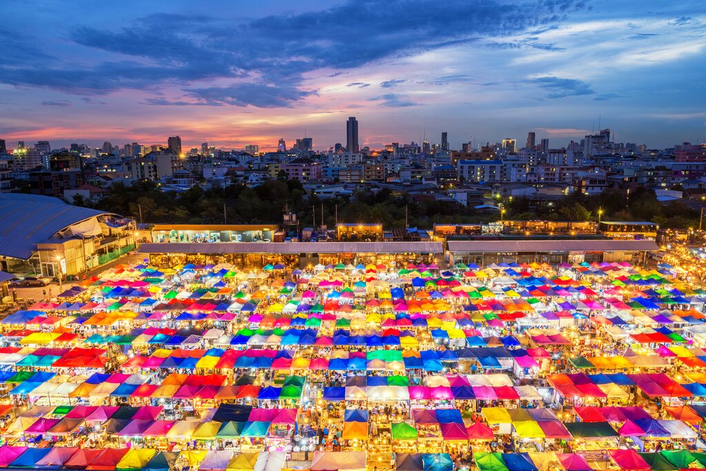 Hundreds of colorful market stalls at night