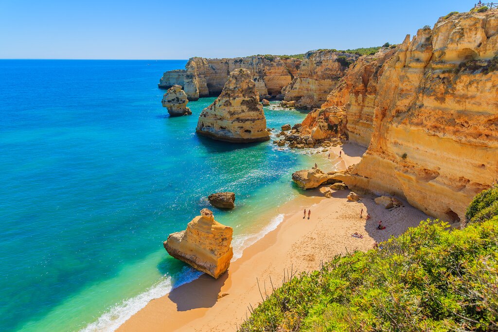 Limestone cliffs next to the ocean in Algarve